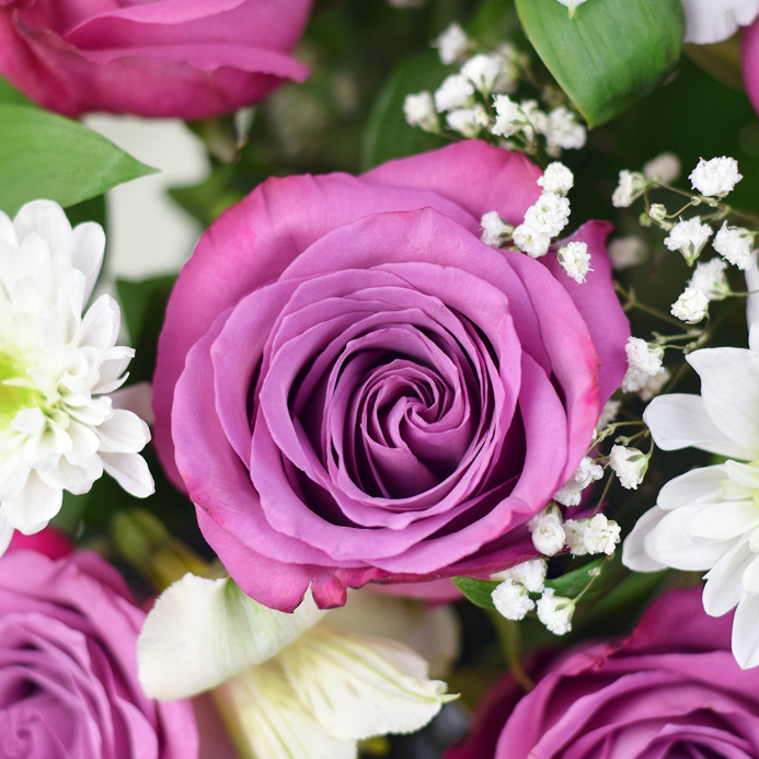 This stunning gift set features a combination of roses and alstroemeria, along with a box of assorted chocolates.