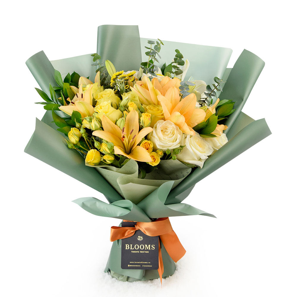 Floral Sunrise Mixed Bouquet. This stunning gift features beautiful lilies, roses, and daisies in full bloom, making it an ideal choice for considerate anniversary or birthday surprises.