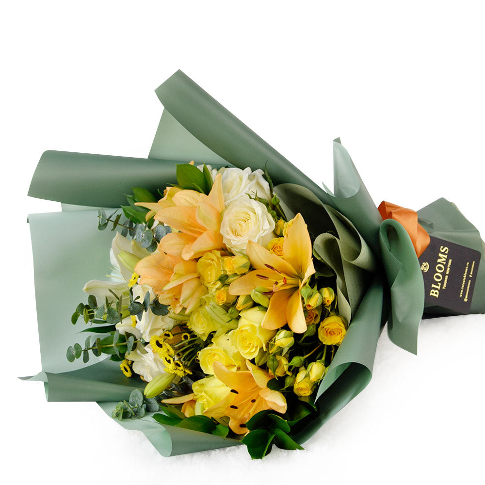 Floral Sunrise Mixed Bouquet. This stunning gift features beautiful lilies, roses, and daisies in full bloom, making it an ideal choice for considerate anniversary or birthday surprises. 