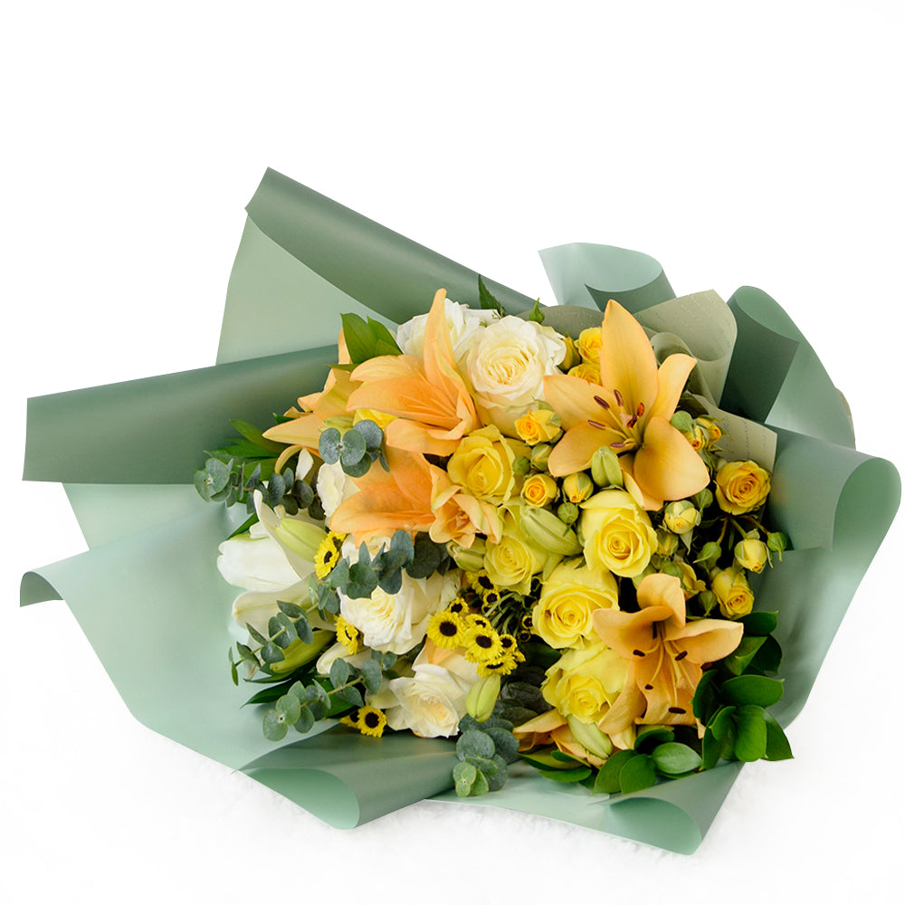 Floral Sunrise Mixed Bouquet. This stunning gift features beautiful lilies, roses, and daisies in full bloom, making it an ideal choice for considerate anniversary or birthday surprises.