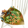 This bouquet features beautifully peach-colored tulips elegantly arranged in a floral wrap. New York Blooms