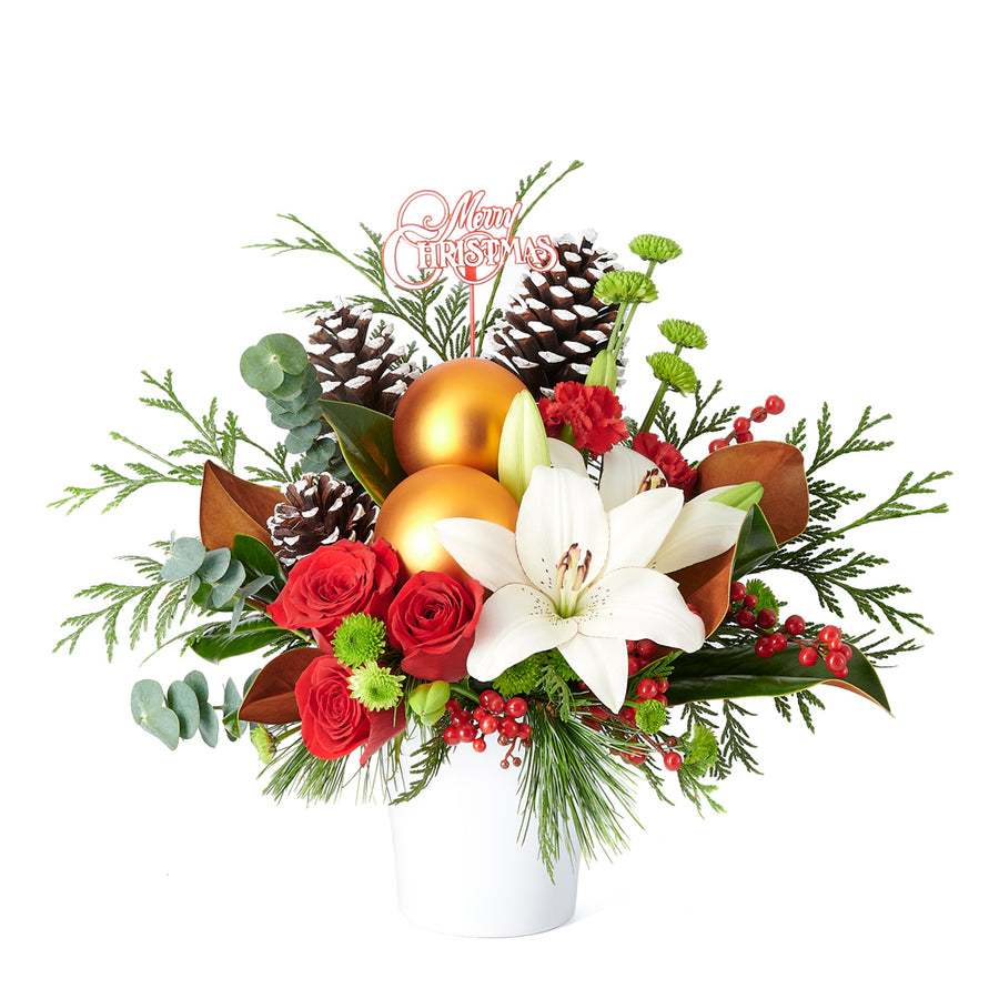 Celebrate the season with something merry and bright! The Joyous Christmas Floral Arrangement is the perfect gift to delight your loved ones.